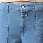 JONES + CO Aria flared jeans in light blue stretch denim with high waist, patch pockets, and wide belt loops.