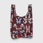 JONES + CO Baggu reusable grocery bag in brown nylon with a multi-coloured western cut-out pattern