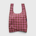 JONES + CO Baggu reusable tote bag in azalea pink and brown tartan plaid pattern made from lightweight ripstop nylon.