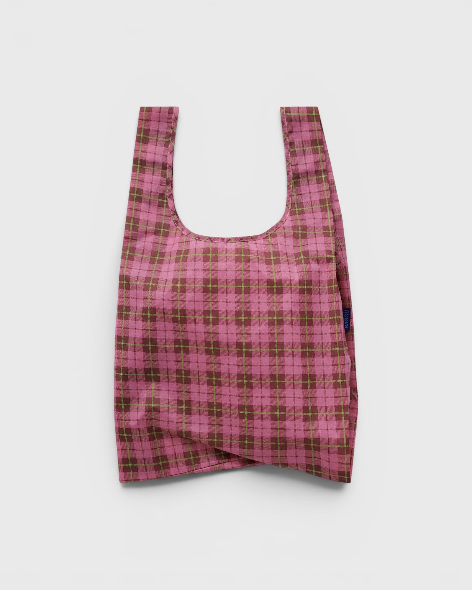 JONES + CO Baggu reusable tote bag in azalea pink and brown tartan plaid pattern made from lightweight ripstop nylon.