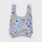 JONES + CO Baggu reusable grocery bag in light blue ripstop nylon with a Get Ready With Me makeup and accessory print