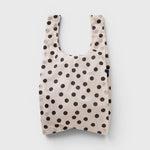 JONES + CO Big Baggu reusable tote in cream with black polka dot pattern, perfect for groceries or beach trips.