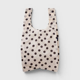 JONES + CO Big Baggu reusable tote in cream with black polka dot pattern, perfect for groceries or beach trips.