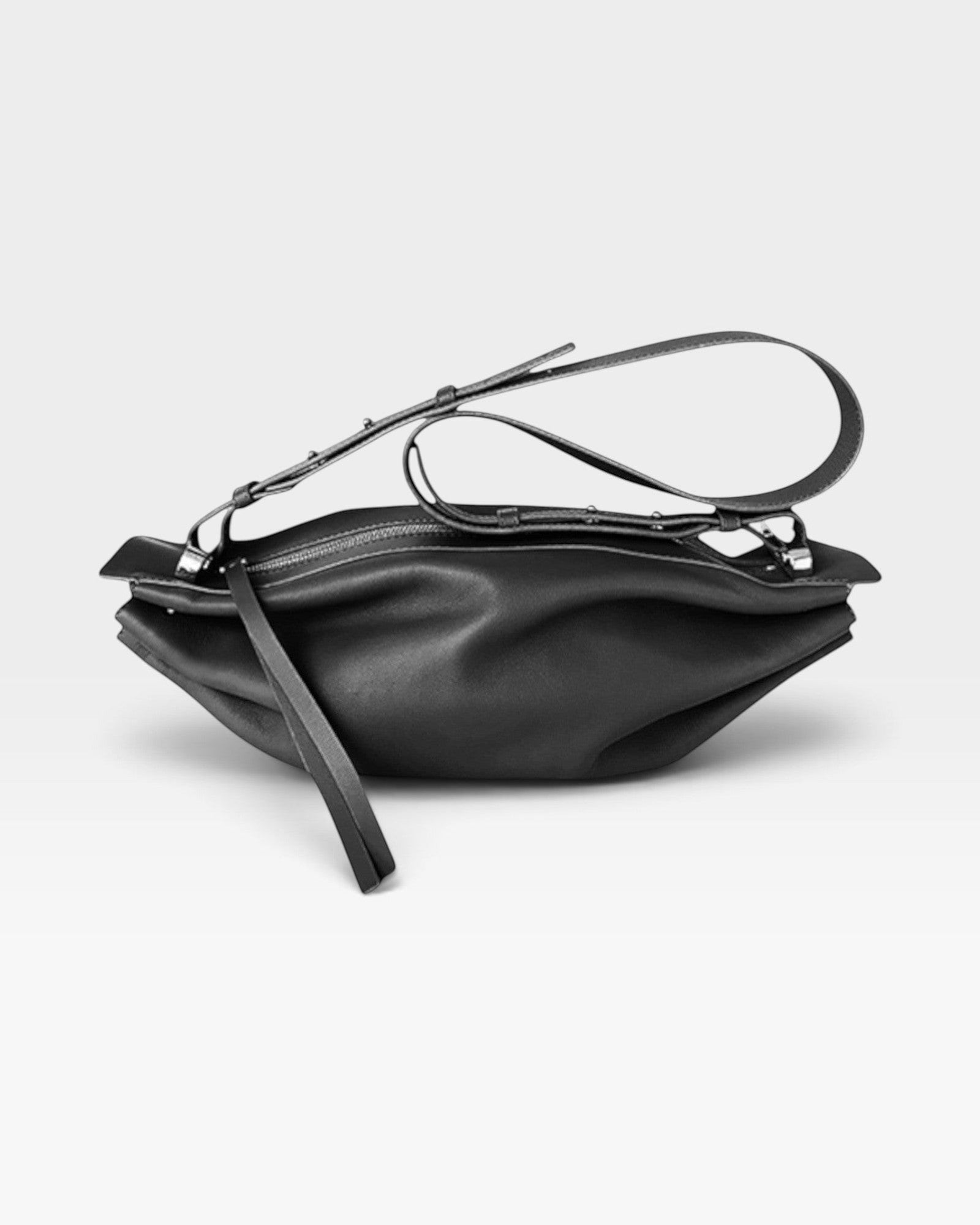JONES + CO Bon-Bon M black soft calf leather crossbody bag with pleated ends and palladium-finished brass hardware.