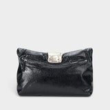 JONES + CO black snake-embossed leather slouchy clutch with a polished silver metal cuff and zip closure.