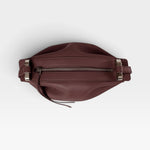 JONES + CO Bon-Bon wine-colored calf leather handbag with pleated ends and palladium-finished brass hardware.