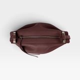 JONES + CO Bon-Bon wine-colored calf leather handbag with pleated ends and palladium-finished brass hardware.