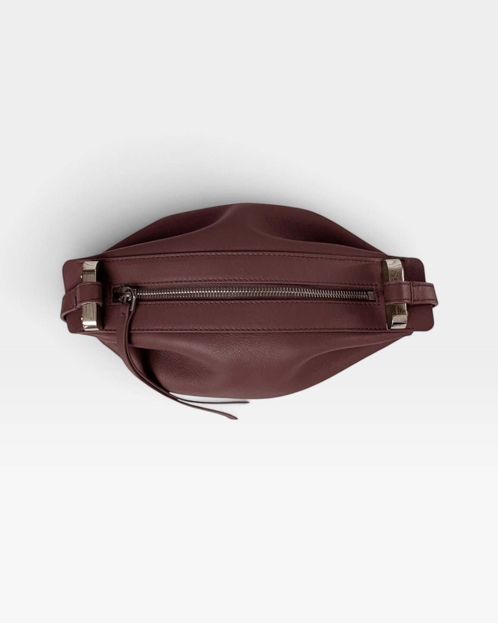 JONES + CO Bon-Bon wine-colored calf leather handbag with pleated ends and palladium-finished brass hardware.