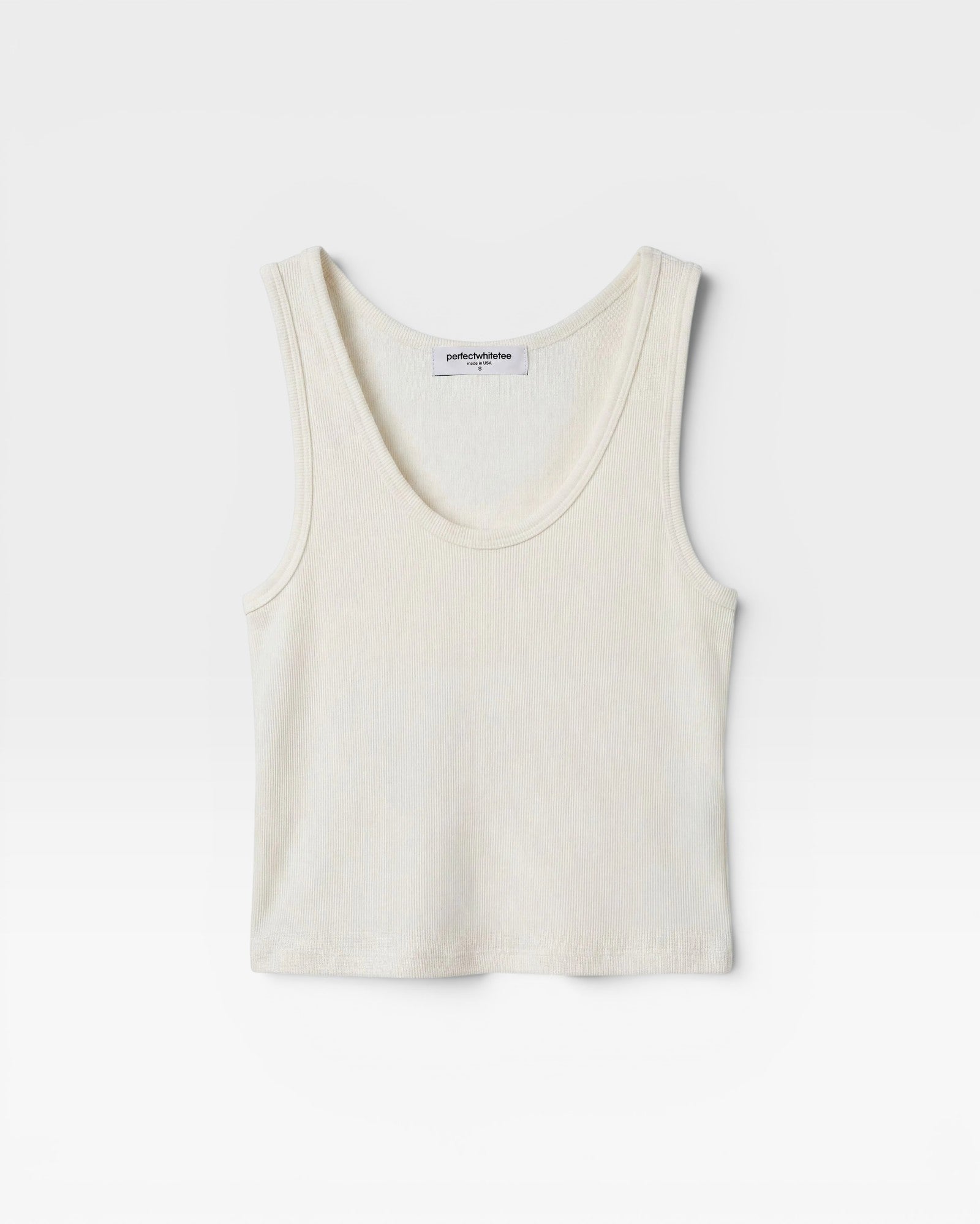 JONES + CO Blondie bright ivory ribbed tank top in a fitted cotton-spandex blend with a scoop neckline.