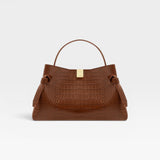 JONES + CO Gyoza pouch in brown Sierra embossed leather with a gold clasp and structured handle