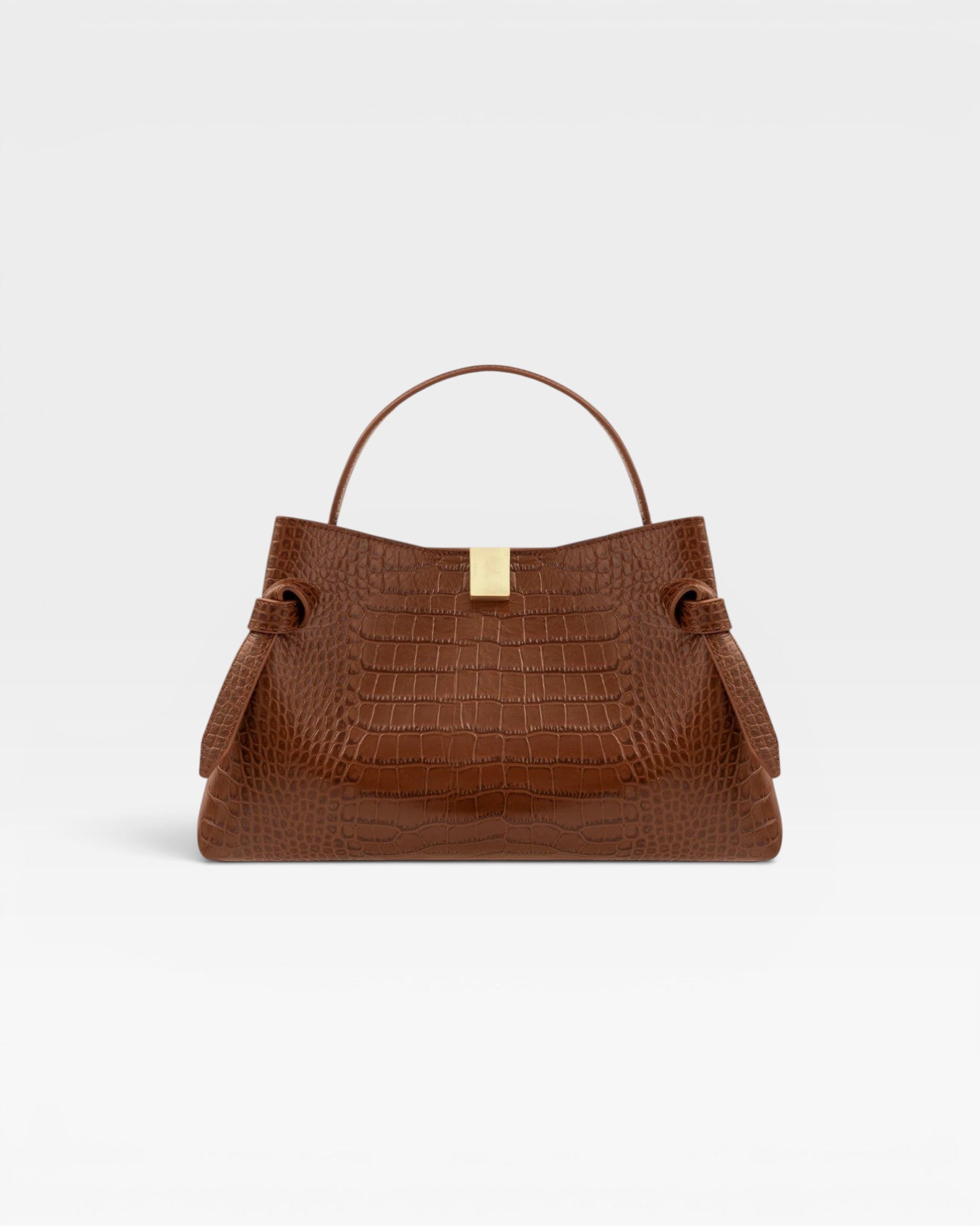 JONES + CO Gyoza pouch in brown Sierra embossed leather with a gold clasp and structured handle