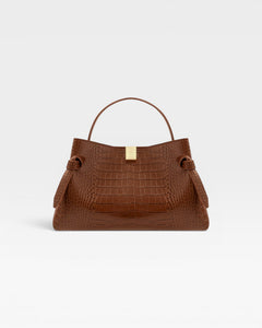 JONES + CO Gyoza pouch in brown Sierra embossed leather with a gold clasp and structured handle