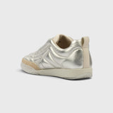 JONES + CO Bubble Ollo sneaker in metallic champagne lambskin leather with a suede toe and translucent foam sole.