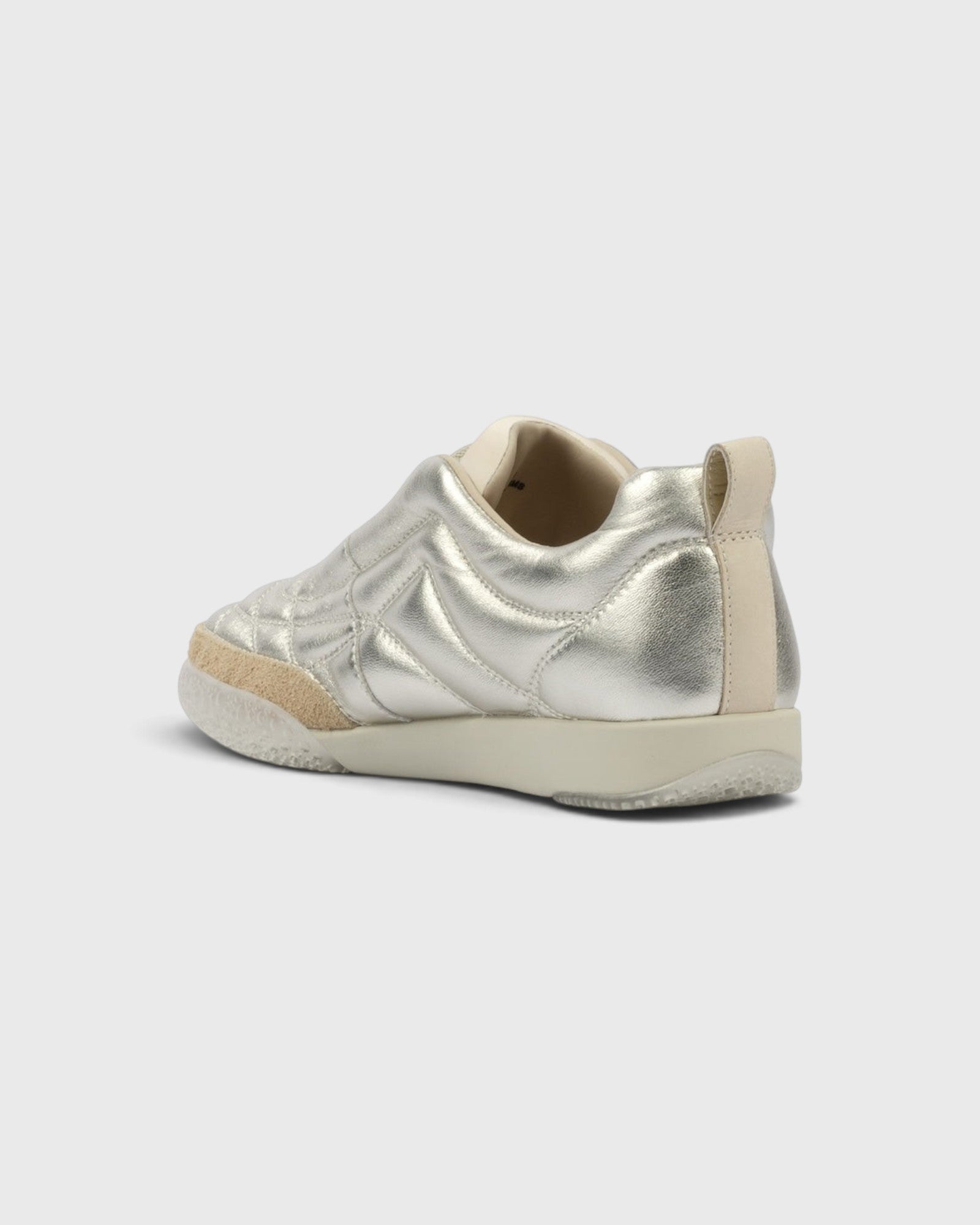 JONES + CO Bubble Ollo sneaker in metallic champagne lambskin leather with a suede toe and translucent foam sole.