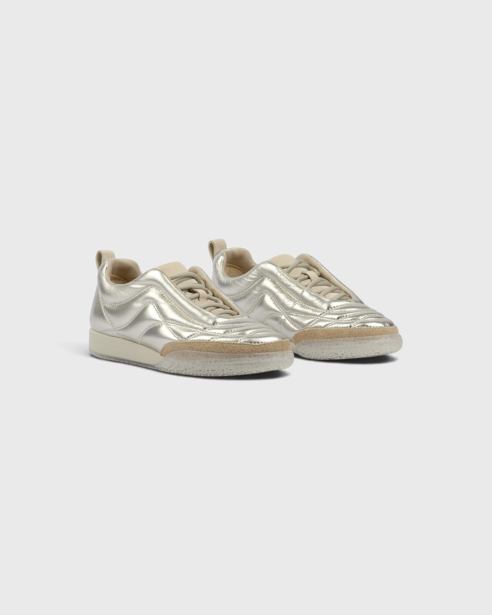 JONES + CO Bubble Ollo sneakers in metallic champagne lambskin leather with a suede toe and translucent bubble sole.