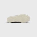 JONES + CO Bubble Ollo sneaker in champagne metallic leather with a translucent, textured bubble-effect outsole.