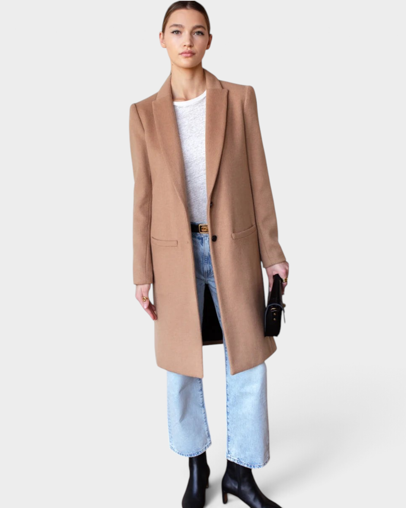 JONES + CO camel wool cashmere tailored coat with notch collar worn by a model with light wash jeans and boots