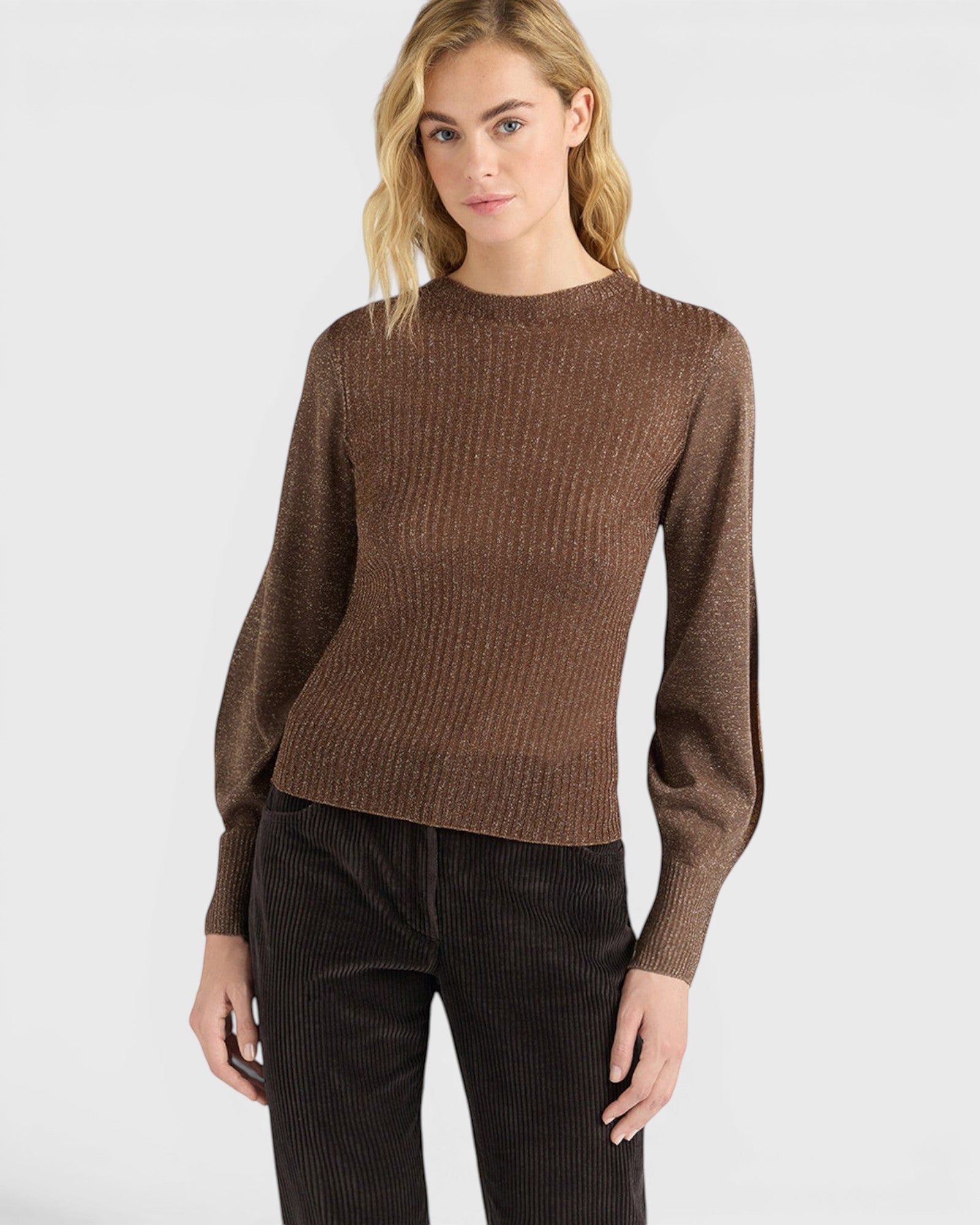 JONES + CO Loa ribbed lurex turtleneck top in caramello brown with long amphora sleeves worn by a model