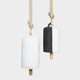 JONES + CO Thrown Bell Domino Indigo set featuring two ceramic bells with rope hangers in white and black finishes.