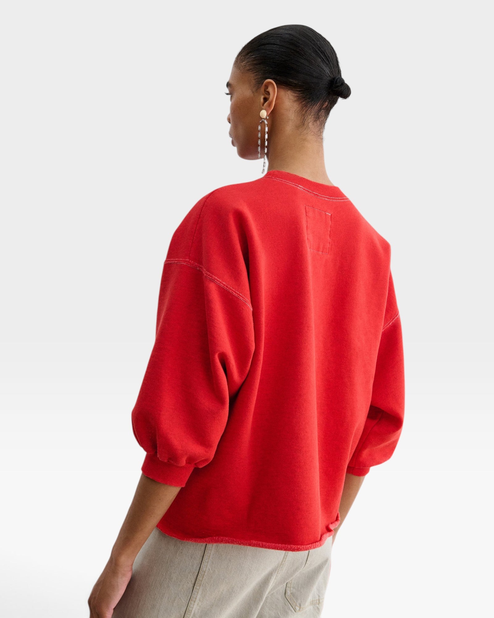 JONES + CO Rachel Comey Fond crewneck sweatshirt in cherry red with drop shoulders and raw edge hem, back view