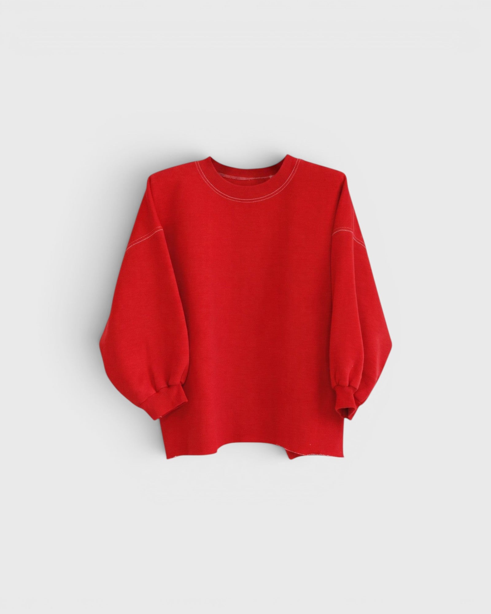 JONES + CO Rachel Comey Fond crewneck sweatshirt in cherry red with drop shoulders and raw edge hemline.