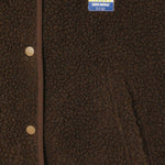 JONES + CO Hoktown sleeveless jacket in chestnut tree melange shearling with snap buttons and branded chest patch