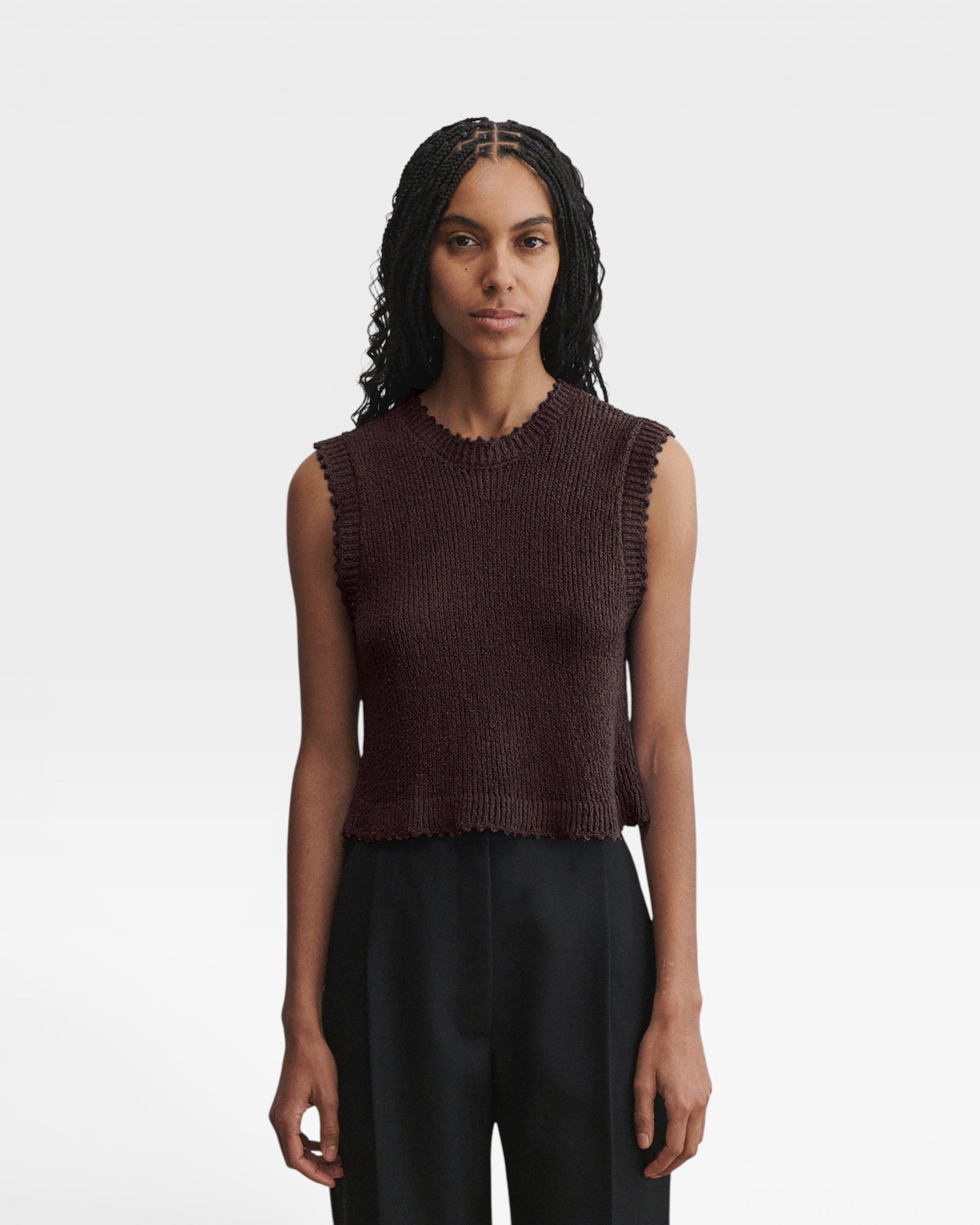 JONES + CO Relent sleeveless chocolate brown cotton boucle crewneck top with hand crocheted picot trim on a model