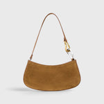 JONES + CO Ollie Bag in cigar brown suede with a crescent silhouette and mixed gold and silver metal link strap