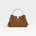 JONES + CO Gyoza Mini handbag in cognac suede with a top handle and gold-tone hardware detail.