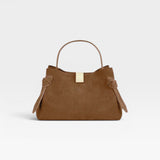 JONES + CO Gyoza Mini handbag in cognac suede with a top handle and gold-tone hardware detail.