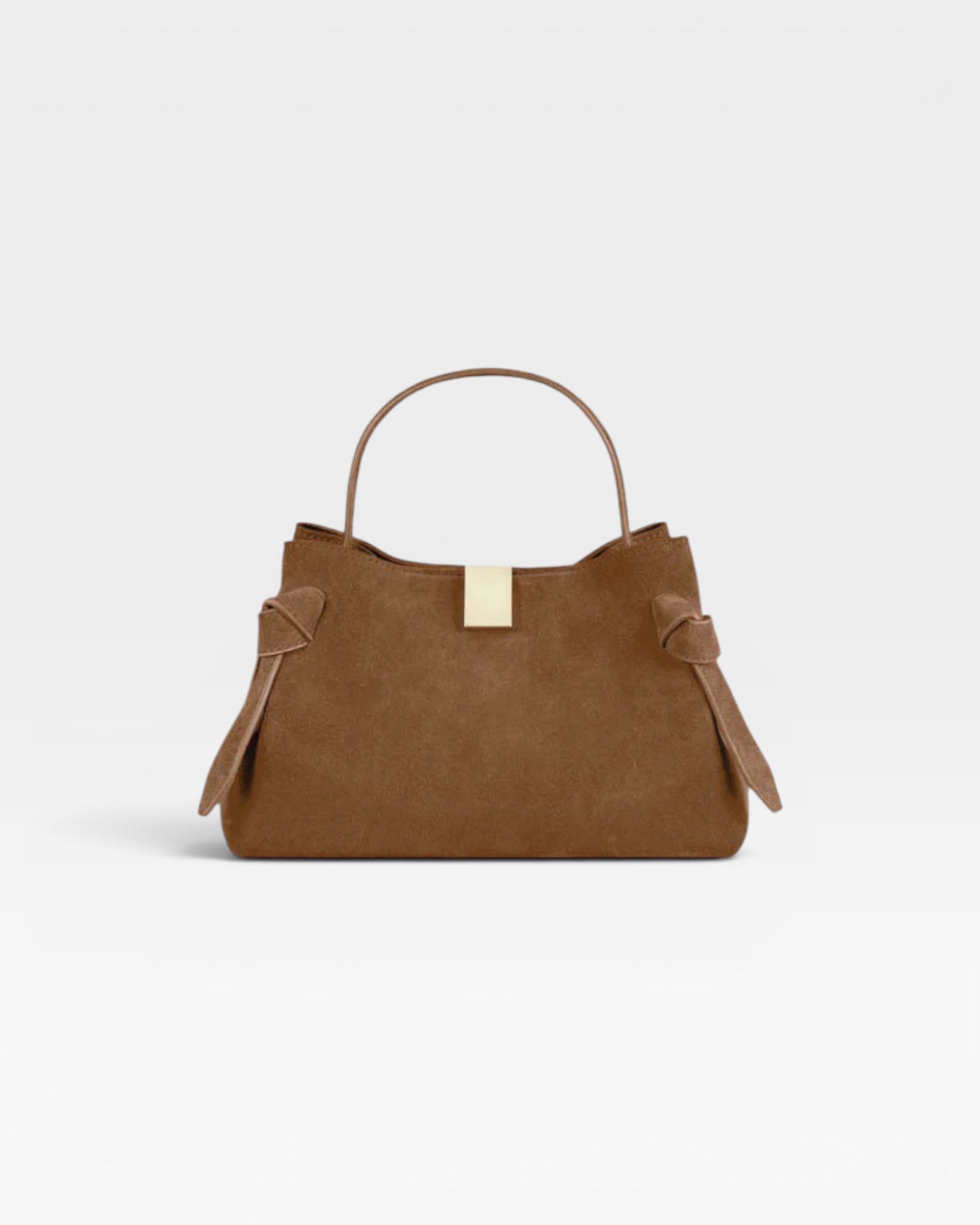 JONES + CO Gyoza Mini handbag in cognac suede with a top handle and gold-tone hardware detail.