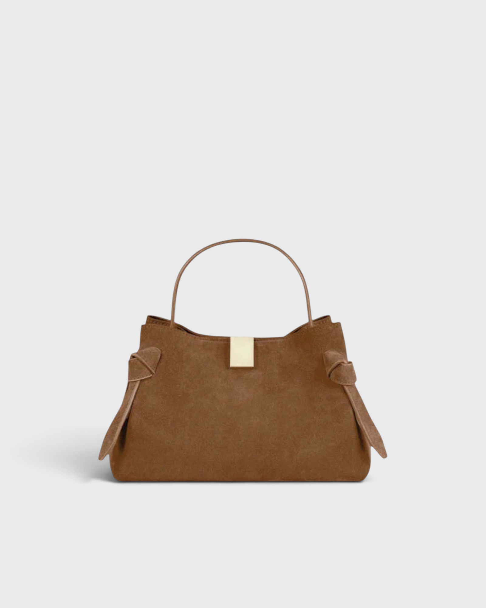 JONES + CO Gyoza Mini handbag in cognac suede with a top handle and gold-tone hardware detail.
