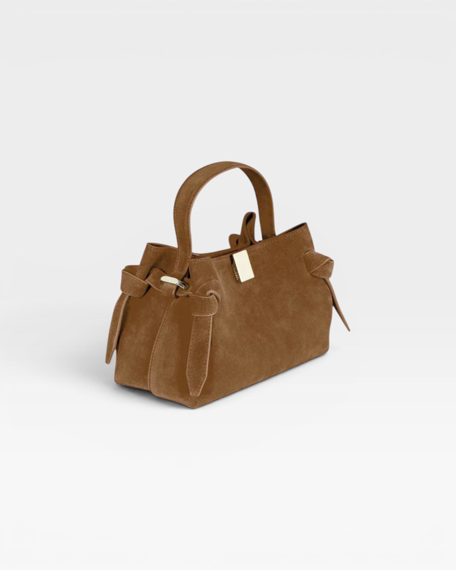 JONES + CO Gyoza Mini handbag in cognac suede with a top handle, knotted side details, and gold-tone hardware.
