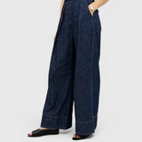 JONES + CO Coxsone high-waisted wide-leg trousers in dark indigo washed denim with pleated front detail