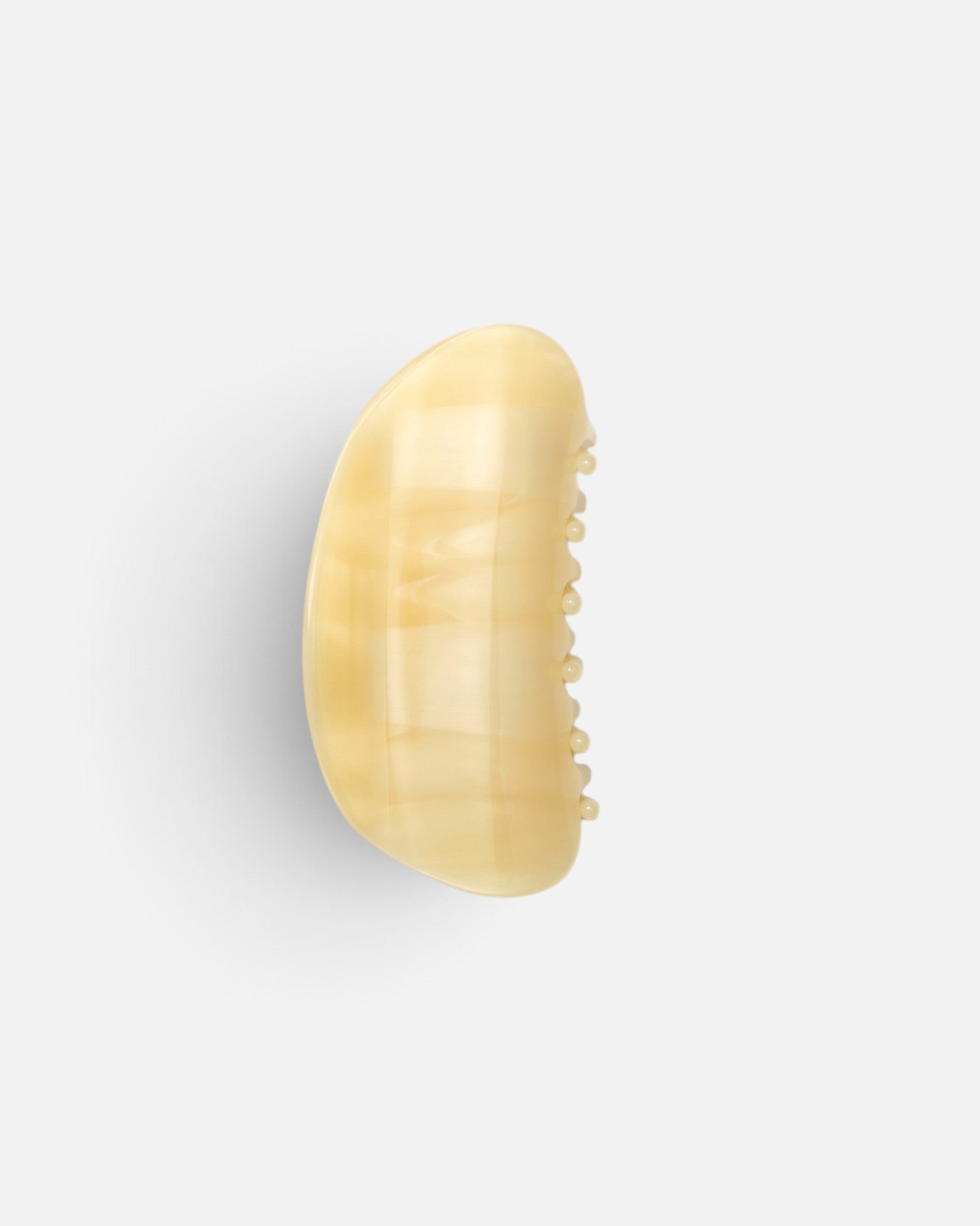 JONES + CO crescent-shaped hair claw clip in a translucent citrine yellow resin with a smooth contoured finish.