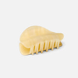 JONES + CO crescent-shaped hair claw clip in a translucent citrine yellow finish with a smooth, contoured design.