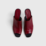 JONES + CO Rachel Comey Dahl scarlet leather sculptural wedge mules with an angular peep toe and slip-on design.