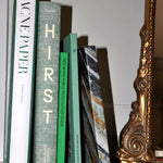 JONES + CO collection featuring Damien Hirst Cherry Blossoms art book alongside Acne Paper and other decorative books.