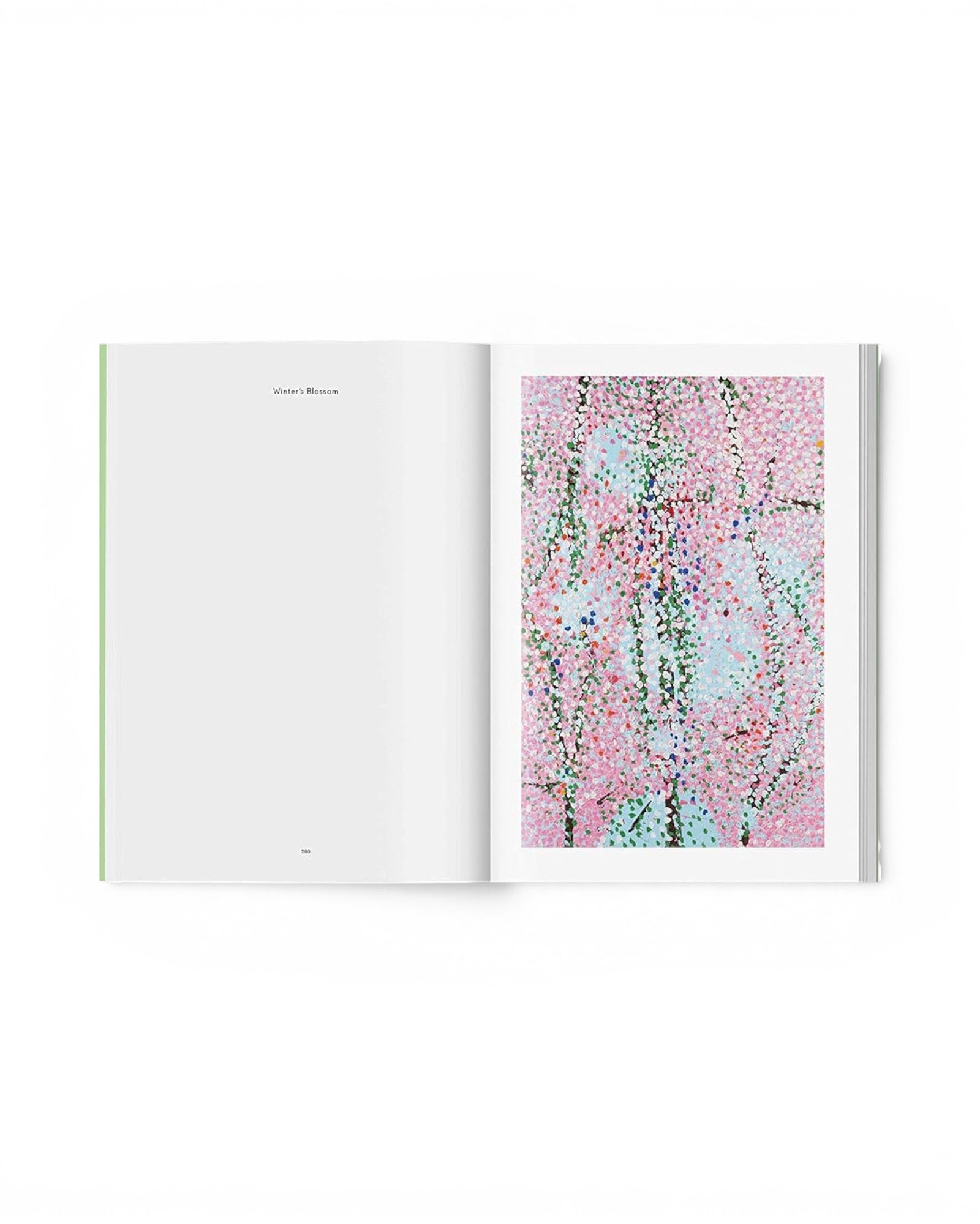 JONES + CO art book open to a page featuring Damien Hirst's vibrant pink and blue Cherry Blossoms painting