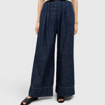 JONES + CO Coxsone high-waisted wide-leg trousers in dark indigo washed denim with front pleats
