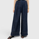 JONES + CO Coxsone high-waisted wide-leg trousers in dark indigo washed denim with front pleats