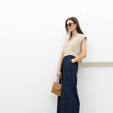 JONES + CO Coxsone high-waisted wide-leg trousers in dark indigo washed denim worn by a model