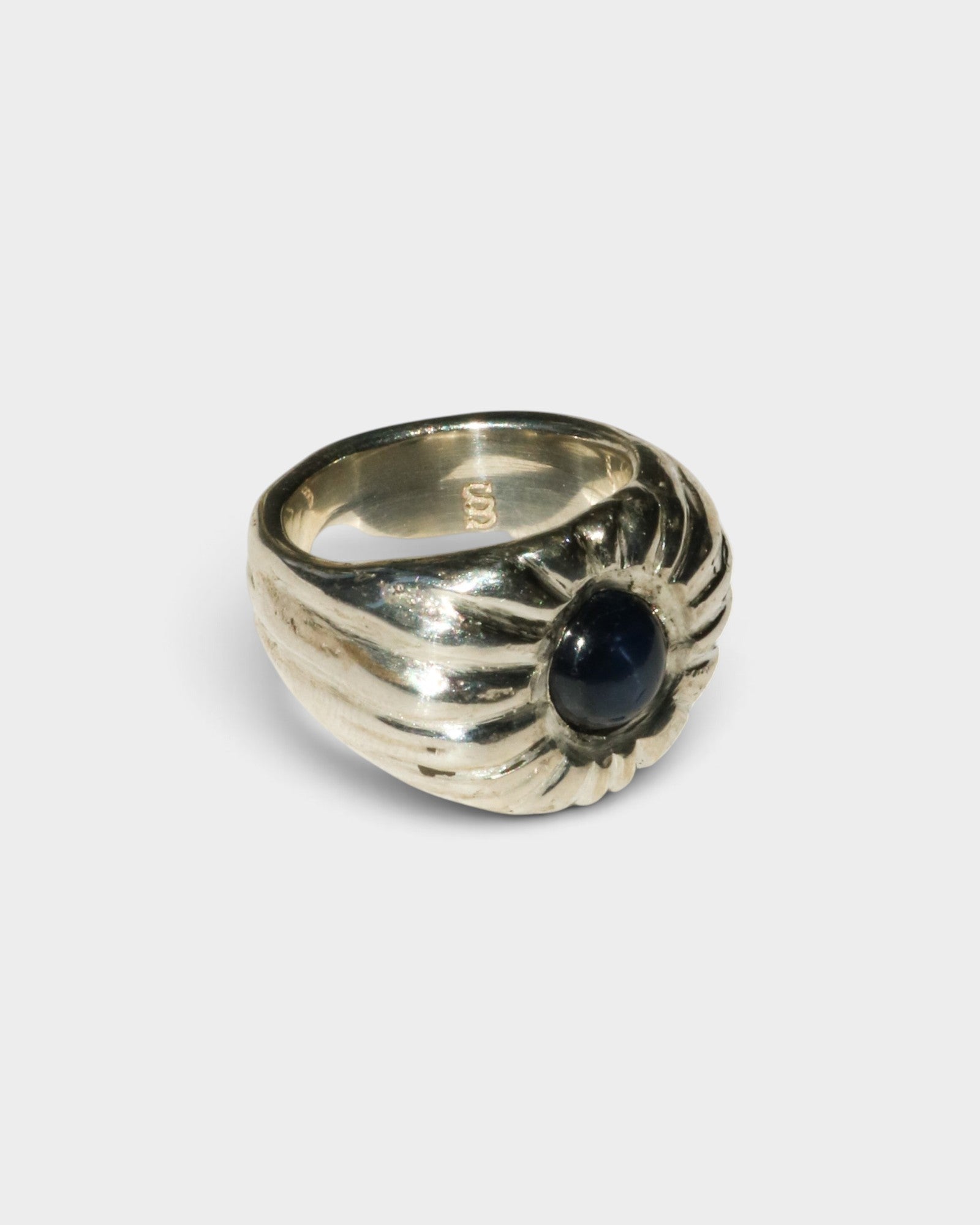 JONES + CO Dean ring in polished .925 sterling silver featuring a bold, sculptural design with a blue star sapphire.