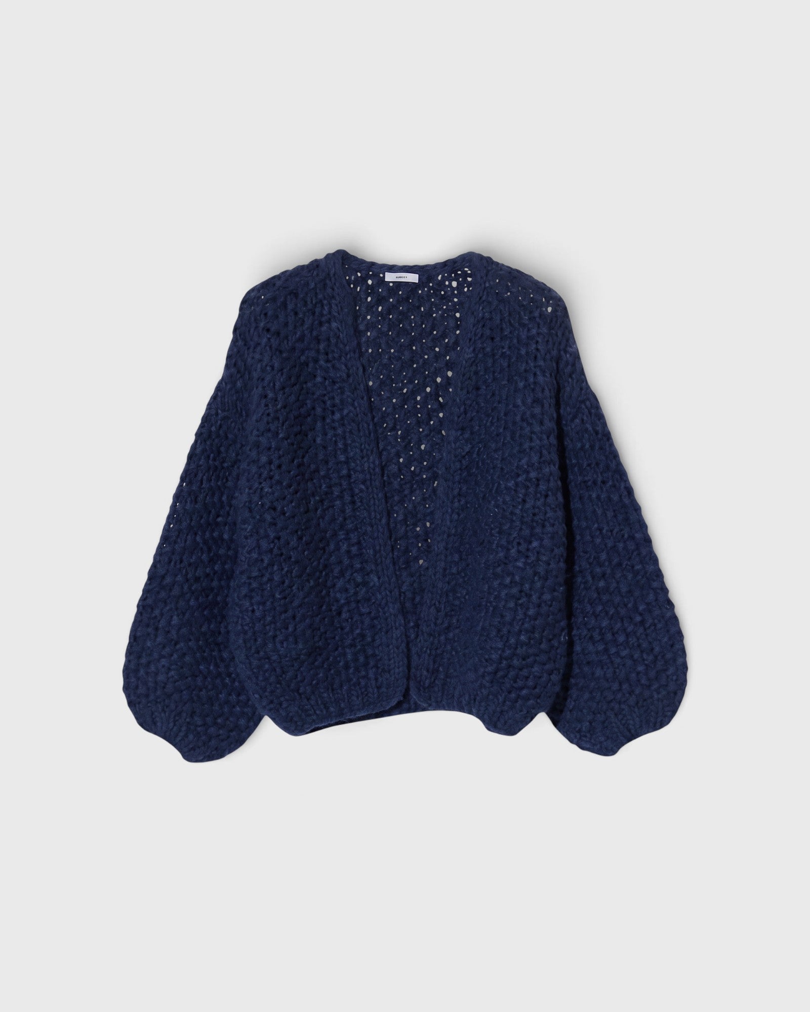 JONES + CO chunky denim blue alpaca bomber cardigan featuring a textured pearl knit pattern and relaxed fit.
