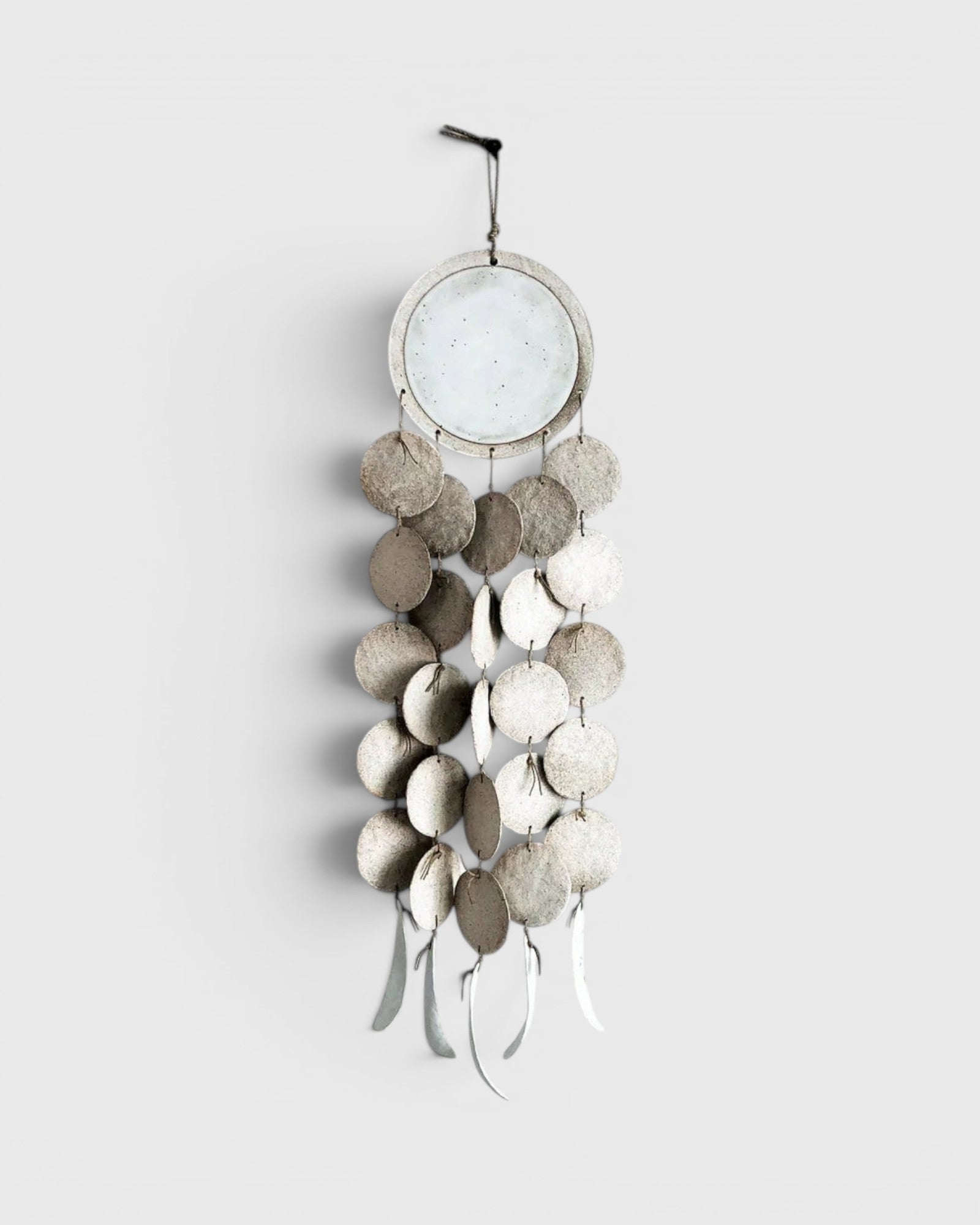 JONES + CO Dreamweaver wall hanging in Full Moon White, featuring stoneware discs, porcelain, and hemp rope.