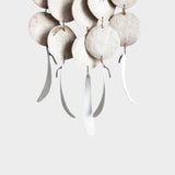 JONES + CO Dreamweaver wall hanging in Full Moon White featuring stoneware discs and hemp rope accents.