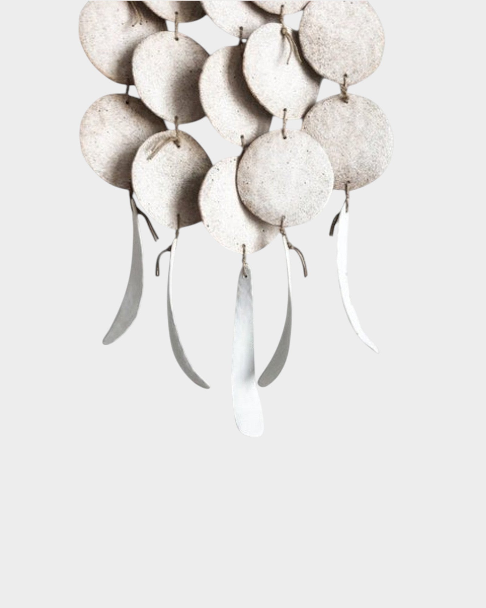 JONES + CO Dreamweaver wall hanging in Full Moon White featuring stoneware discs and hemp rope accents.