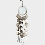 JONES + CO Dreamweaver wall hanging in Full Moon White, featuring stoneware discs and waxed hemp twine.