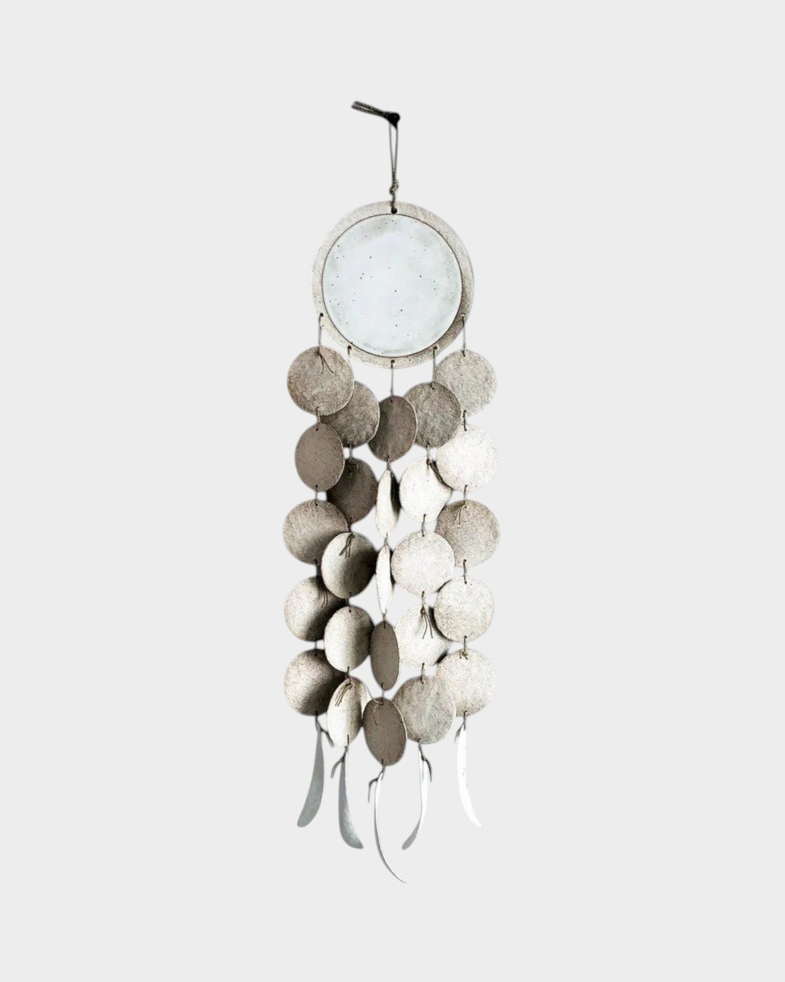 JONES + CO Dreamweaver wall hanging in Full Moon White, featuring stoneware discs and waxed hemp twine.