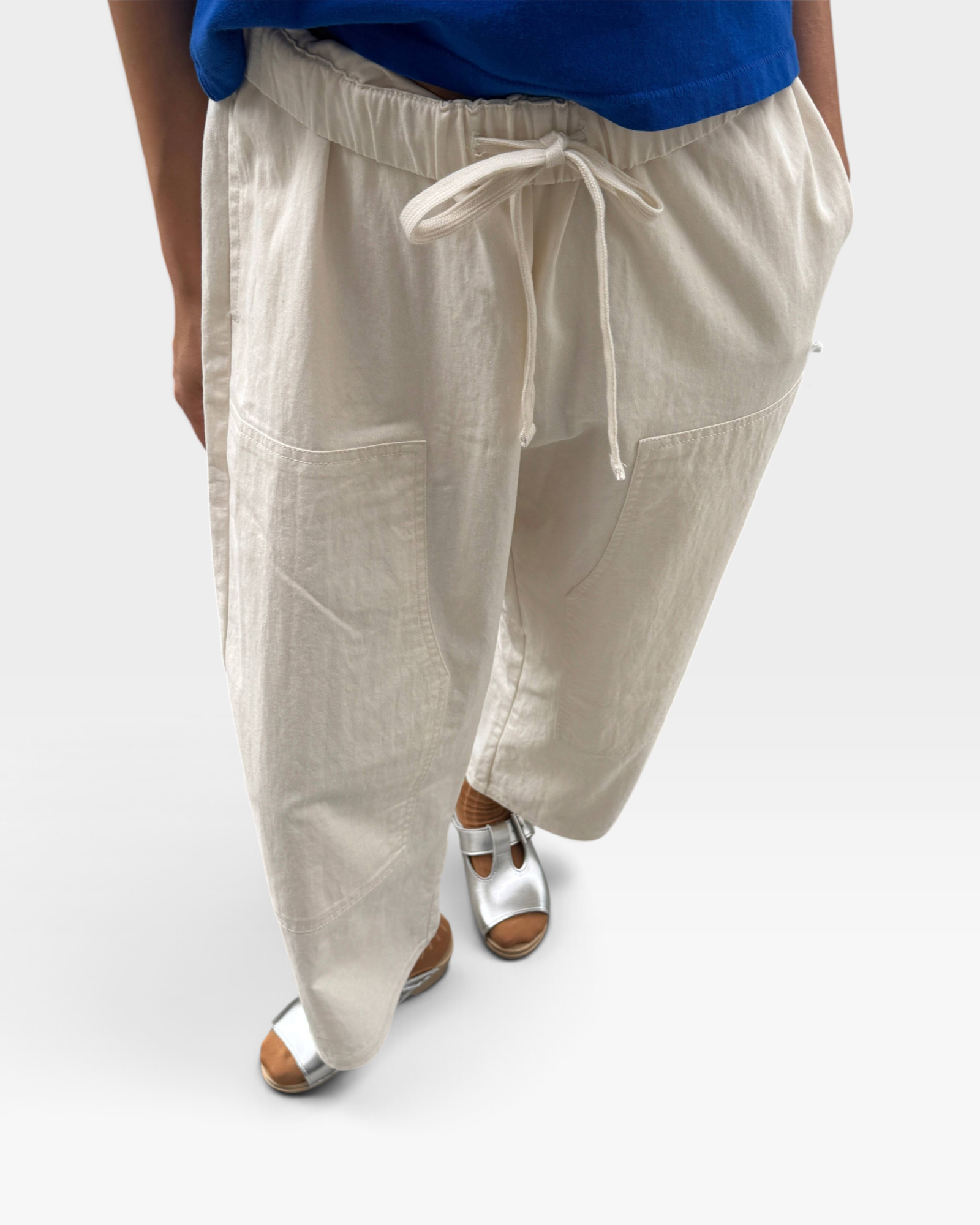 JONES + CO ecru gardener pants in lightweight cotton-nylon with an elastic waist, drawstring, and utility pockets.